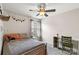 Bedroom featuring light gray walls, carpeted floors, a desk, and decorative lighting at 1680 Beleek Ridge Ln, Clover, SC 29710