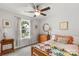 Cozy bedroom with neutral walls, carpet, a decorative quilt, and lots of natural light at 1680 Beleek Ridge Ln, Clover, SC 29710