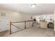 Upstairs bonus room with comfortable seating, play area, and lots of natural light at 1680 Beleek Ridge Ln, Clover, SC 29710