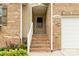 Inviting entryway with brick steps and a cozy, covered porch at 1680 Beleek Ridge Ln, Clover, SC 29710