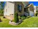 Beautifully landscaped front yard with brick accent and view of the attached garage at 1680 Beleek Ridge Ln, Clover, SC 29710