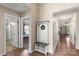 Open hallway with hardwood floors, coat rack and access to multiple rooms at 1680 Beleek Ridge Ln, Clover, SC 29710