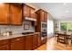Well-equipped kitchen with stainless appliances, granite counters, and wood cabinetry at 1680 Beleek Ridge Ln, Clover, SC 29710