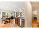 Bright kitchen and dining area featuring hardwood floors, stainless steel appliances, and granite countertops at 1680 Beleek Ridge Ln, Clover, SC 29710