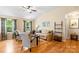 Comfortable living room with vaulted ceiling, hardwood floors, and natural light from large windows at 1680 Beleek Ridge Ln, Clover, SC 29710