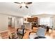 Bright living room area with hardwood floors, ceiling fan, and view of the kitchen at 1680 Beleek Ridge Ln, Clover, SC 29710
