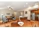 Open-concept living space with kitchen, dining and living areas, featuring hardwood floors at 1680 Beleek Ridge Ln, Clover, SC 29710
