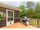 Screened-in porch with a grill overlooking a spacious yard, perfect for entertaining at 1680 Beleek Ridge Ln, Clover, SC 29710