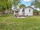 Spacious backyard featuring a patio, fire pit, and lush lawn, perfect for outdoor enjoyment at 1714 Edgewater Dr, Charlotte, NC 28210