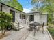 Outdoor patio with table and chairs for relaxation and outdoor dining at 1714 Edgewater Dr, Charlotte, NC 28210
