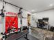 Basement interior with fitness equipment and workspace, ready for recreation and work at 1714 Edgewater Dr, Charlotte, NC 28210