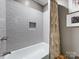 Bathroom showcasing tiled shower and recessed niche at 1714 Edgewater Dr, Charlotte, NC 28210