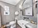 Stylish bathroom with modern fixtures, vessel sink, framed mirror, and tiled shower at 1714 Edgewater Dr, Charlotte, NC 28210