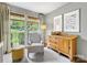 Bedroom boasting large windows, wood floors, and ample natural light at 1714 Edgewater Dr, Charlotte, NC 28210