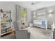 Bright bedroom with a crib, chair, and a large window and ceiling fan at 1714 Edgewater Dr, Charlotte, NC 28210