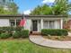 Charming single-story home featuring a well-manicured lawn, classic brick facade, and an inviting front entrance at 1714 Edgewater Dr, Charlotte, NC 28210