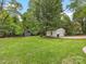 Detached two-car garage and shed, offering ample storage in a large, green backyard at 1714 Edgewater Dr, Charlotte, NC 28210
