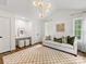 Bright living room with vaulted ceilings, checkerboard rug, and large windows offers ample natural light at 1714 Edgewater Dr, Charlotte, NC 28210