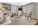 Bright living room showcasing hardwood floors, neutral walls, built-in shelving, and elegant decor at 1714 Edgewater Dr, Charlotte, NC 28210
