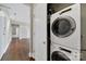 Laundry closet featuring a stackable washer and dryer set at 2200 Lyndhurst Ave # 203, Charlotte, NC 28203