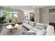 Staged living room boasts a large window view, hardwood floors, and modern furniture at 2200 Lyndhurst Ave # 203, Charlotte, NC 28203