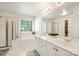 Bright bathroom with double vanity, garden tub, shower, and ample storage, designed for comfort and functionality at 2620 Shady Reach Ln, Charlotte, NC 28214