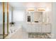 Bright bathroom with double vanity, garden tub, and gold accents at 2620 Shady Reach Ln, Charlotte, NC 28214