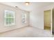 Bright bedroom with two large windows and a closet at 2620 Shady Reach Ln, Charlotte, NC 28214