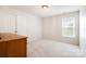 Neutral bedroom with closet, window, and carpet at 2620 Shady Reach Ln, Charlotte, NC 28214