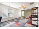 Large, naturally lit bonus room with unique carpet tiles and versatile space at 2620 Shady Reach Ln, Charlotte, NC 28214