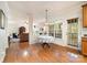Sunlit dining area with hardwood floors and view to the living room at 2620 Shady Reach Ln, Charlotte, NC 28214
