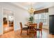 Cozy dining room with a chandelier, a view to living areas, and natural light at 2620 Shady Reach Ln, Charlotte, NC 28214