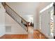 Welcoming foyer with hardwood floors, stained glass accent window, and staircase at 2620 Shady Reach Ln, Charlotte, NC 28214