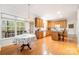 Bright kitchen with wood cabinets, an island, hardwood floors, and a sunlit breakfast nook at 2620 Shady Reach Ln, Charlotte, NC 28214