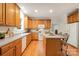 Spacious kitchen featuring ample counter space, wooden cabinets, and a center island at 2620 Shady Reach Ln, Charlotte, NC 28214