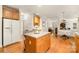Open kitchen offers an island, flows to dining area and living room, great for entertaining at 2620 Shady Reach Ln, Charlotte, NC 28214