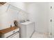 Convenient laundry room with modern appliances and storage shelves at 2620 Shady Reach Ln, Charlotte, NC 28214