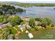 Aerial view of the lakeside property showing the home, boathouse, and beautiful waterfront setting at 273 Leeward Point Loop # 14, Taylorsville, NC 28681