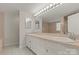A well-lit bathroom featuring a dual sink vanity, a large mirror, and a separate tub area at 273 Leeward Point Loop # 14, Taylorsville, NC 28681