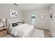Well-lit staged bedroom with calming decor and back patio access at 273 Leeward Point Loop # 14, Taylorsville, NC 28681