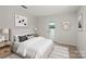 Bright bedroom features neutral decor, natural light, and a door leading to the outdoors at 273 Leeward Point Loop # 14, Taylorsville, NC 28681