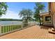 Spacious wooden deck with white railings, perfect for enjoying views of the lake at 273 Leeward Point Loop # 14, Taylorsville, NC 28681