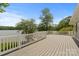 Spacious deck area with white railing overlooks the water and surrounding lush greenery at 273 Leeward Point Loop # 14, Taylorsville, NC 28681
