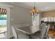 Dining room with chandelier lighting and door leads to outdoor deck with lake view at 273 Leeward Point Loop # 14, Taylorsville, NC 28681