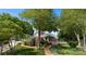 Charming home featuring lush landscaping, covered porch, and an inviting walkway at 273 Leeward Point Loop # 14, Taylorsville, NC 28681