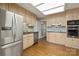 Bright kitchen boasts stainless steel appliances, granite countertops, and wood cabinetry at 273 Leeward Point Loop # 14, Taylorsville, NC 28681