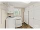 Laundry room featuring washer, dryer, storage cabinets, and shelving at 273 Leeward Point Loop # 14, Taylorsville, NC 28681