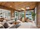 Spacious living room with lake views, wood ceiling, stylish furniture, and an open floor plan at 273 Leeward Point Loop # 14, Taylorsville, NC 28681