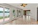 Sunroom featuring a tiled floor, many windows, and French doors leading to an outdoor deck at 273 Leeward Point Loop # 14, Taylorsville, NC 28681