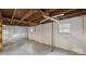 Spacious unfinished basement with painted concrete floors and support beams, ready to be transformed at 331 5Th Se Ave, Hickory, NC 28602